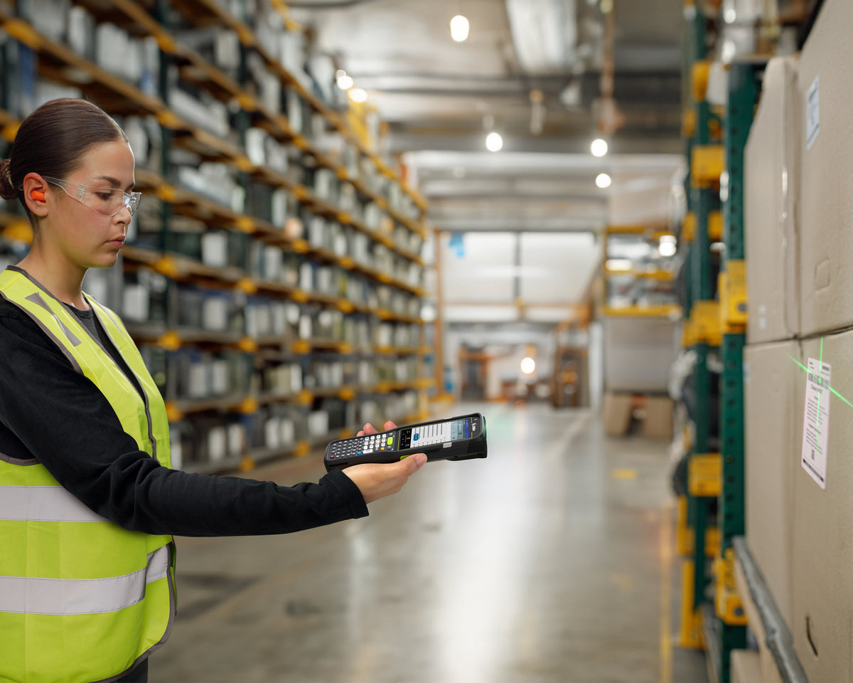 Zebra MC3450 rugged 5G keypad mobile computer, straight shooter, 38-key function numeric keypad (MC345B-3S1R63SS-A6) – in use in a warehouse